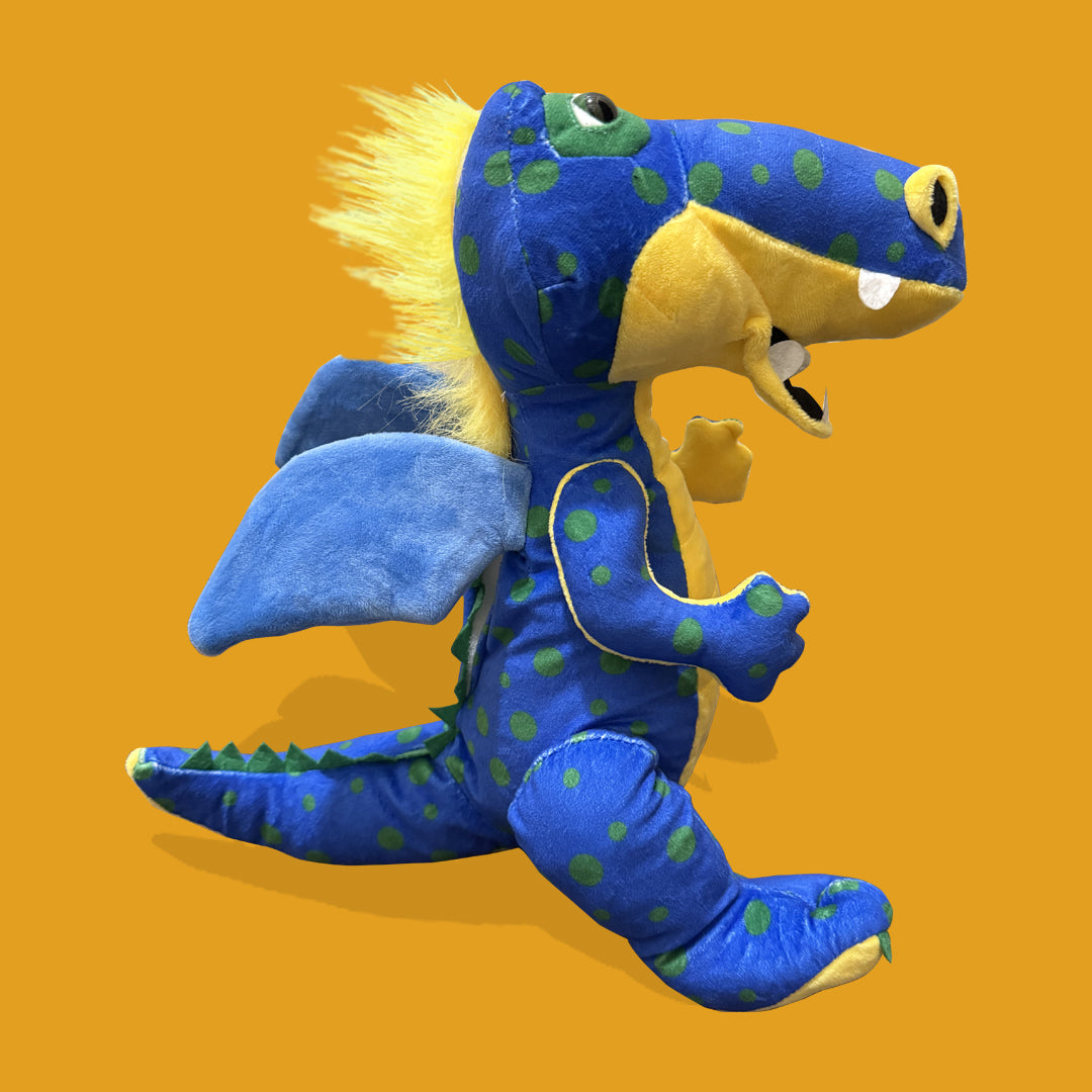 Blue and yellow dinosaur plush toy on a yellow background